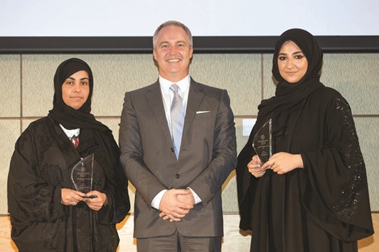 Winners of u2018Best Fiction Filmu2019, Hissa al-Mannai and Sulaima AlHaj Abed with a dignitary.