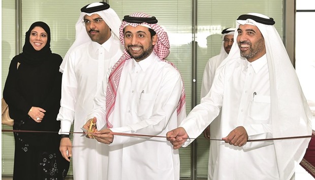 Dr Hassan al-Derham cutting the ribbon in the presence of other officials to inaugurate the career fair.