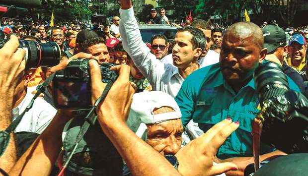 Venezuelan opposition leader and self-proclaimed acting president Juan Guaido gives the thumb up during a demonstration in Caracas yesterday.