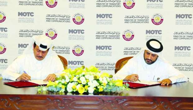 Rashid Taleb al-Nabet and Badr Omar al-Mana signing the contract at the MoTCu2019s West Bay headquarters