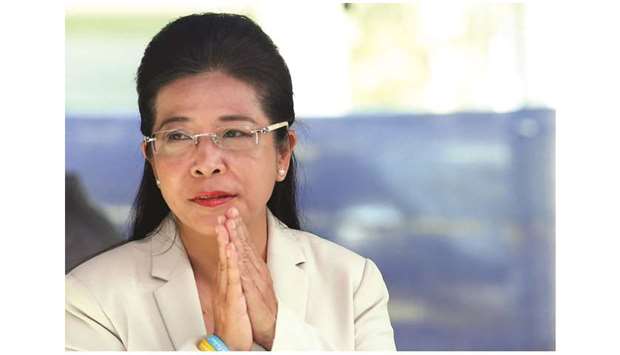 Sudarat Keyuraphan, Pheu Thai Partyu2019s prime minister candidate, gestures during the general election at a polling station in Bangkok.