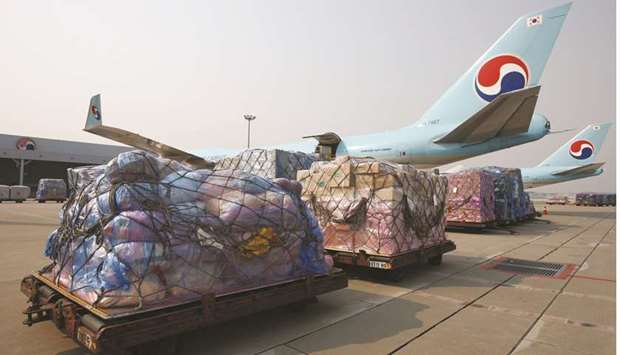 Cargo bound for export to China sits on the tarmac next to a Korean Air Lines freight plane at the companyu2019s cargo terminal at Incheon International Airport in Incheon, South Korea (file). Global air freight segment contracted 1.8% in January this year, IATA data reveal. And global year-over-year volumes fell 1.5% when compared to December 2017, which meant the year-end growth figure for 2018 was 3.3%.