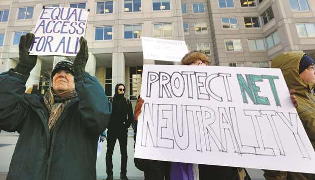 File photo of Net neutrality advocates rallying in front of the Federal Communications Commission in Washington.