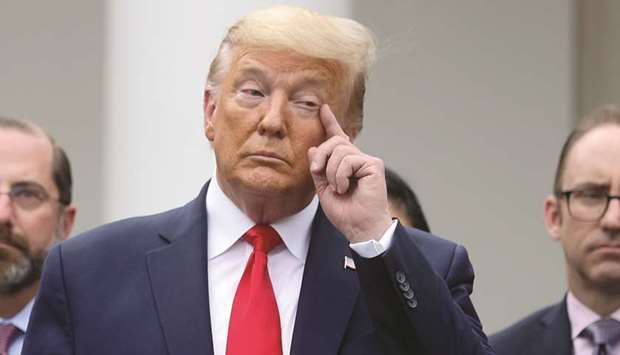 US President Donald Trump pauses during a news conference where he declared the coronavirus pandemic a national emergency in the Rose Garden of the White House in Washington, US, March 13, 2020.
