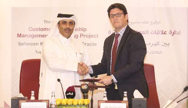 Kahramaa president engineer Essa bin Hilal al-Kuwari and Oracleu2019s David de Mayo at the signing ceremony yesterday.