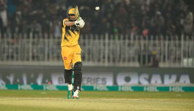 Peshawar Zalmiu2019s Shoaib Malik plays a shot during the PSL T20 match against Quetta Gladiators in Rawalpindi yesterday. (AFP)