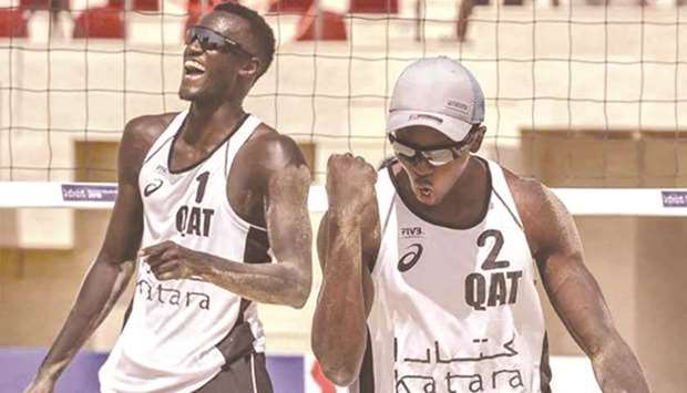 Qataru2019s Cherif Younousse (left) and Ahmed Tijan.