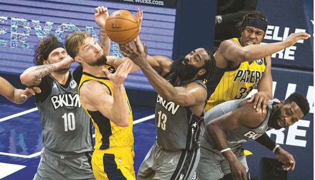 Indiana Pacers forward Domantas Sabonis and Brooklyn Nets guard James Harden fight for a rebound in the fourth quarter at Bankers Life Fieldhouse. (USA TODAY Sports)