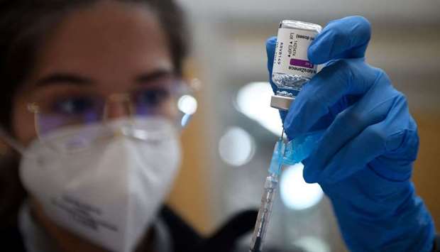 A nurse fills a syringe with the AstraZeneca Covid-19 vaccine