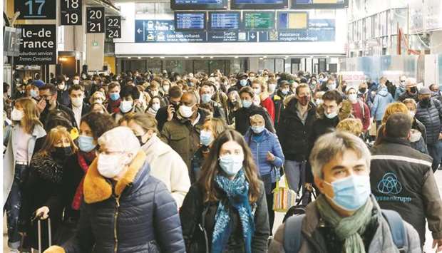 Parisians are seen at the Gare Montparnasse station, serving the west and southwest of France.