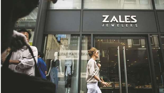 Pedestrians pass in front of a Zales Jewellers store in New York. Signet Jewellers Ltd, which owns chains such as Kay and Zales, said past week it will expand in off-mall locations while continuing to pull back from the old-school gallerias where it has long had a major presence.