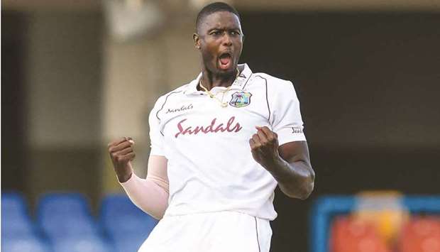 Jason Holder of the West Indies celebrates the dismissal of Lasith Embuldeniya of Sri Lanka at the Vivian Richards Cricket Stadium in North Sound, Antigua and Barbuda, on Sunday.