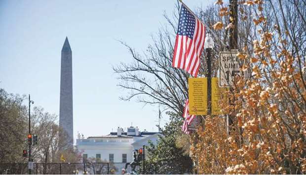 US Stars and Stripe flags with 51 stars (an extra star for the District of Columbia) are set up on poles on Black Lives Matter Plaza next to the White House in Washington, DC.