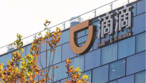 A Didi logo is seen at the headquarters of Didi Chuxing in Beijing. Chinau2019s top ride-hailing firm is leaning towards picking New York over Hong Kong for its initial public offering, eyeing a valuation of at least $100bn via the float, according to reports.