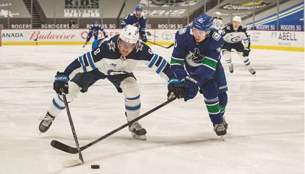 Hellebuyck posts 1st shutout of season, Jets top Canucks 4-0