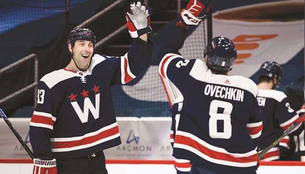 Washington Capitals defenseman Zdeno Chara celebrates with left wing Alex Ovechkin (right) after the game against the New Jersey Devils at Capital One Arena. (USA TODAY Sports)