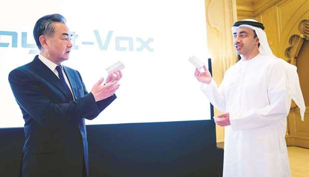 Chinau2019s State Councilor and Foreign Minister Wang Yi and UAEu2019s Foreign Minister Abdullah bin Zayed al-Nahyan show the Chinese made coronavirus vaccine Sinopharm during their meeting in Abu Dhabi on Sunday. A new factory in Abu Dhabi will start manufacturing a Covid-19 vaccine from Chinese pharmaceutical giant Sinopharm later this year under a joint venture between Sinopharm and Abu Dhabi-based technology company Group 42 (G42).