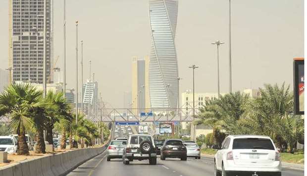 Saudi commuters drive down a main street in the capital Riyadh (file). The state news agency SPA said in early February that 24 international firms had signed agreements to establish main regional offices in Riyadh.