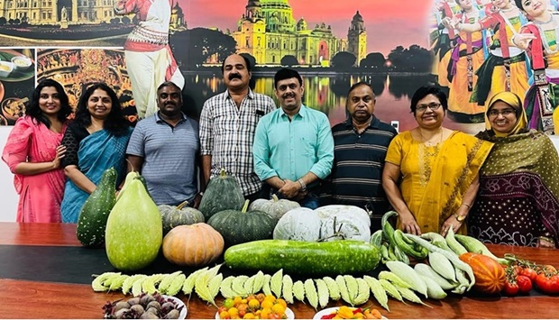 Our Kitchen Garden Doha members with a harvest.