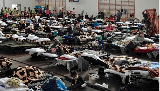 Refugees rest in a temporary shelter at a gym of a primary school in Przemysl, near the Polish-Ukrainian border on March 12.