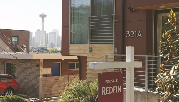 A u2018for saleu2019 sign is posted outside a residential home in Seattle, Washington. Existing home sales in US dropped 7.2% to a seasonally adjusted annual rate of 6.02mn units last month, the largest decrease since February 2021, the National Association of Realtors said yesterday.