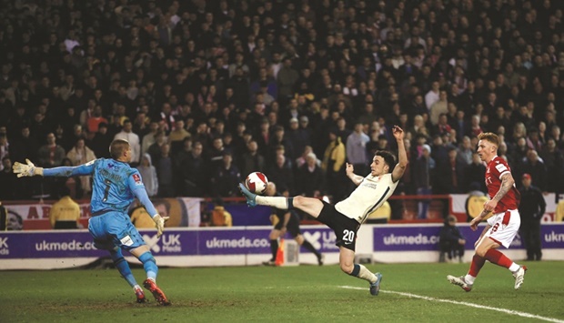 Liverpoolu2019s Diogo Jota scores a goal in FA Cup quarter-final against Nottingham Forest at the The City Ground in Nottingham yesterday. (Reuters)