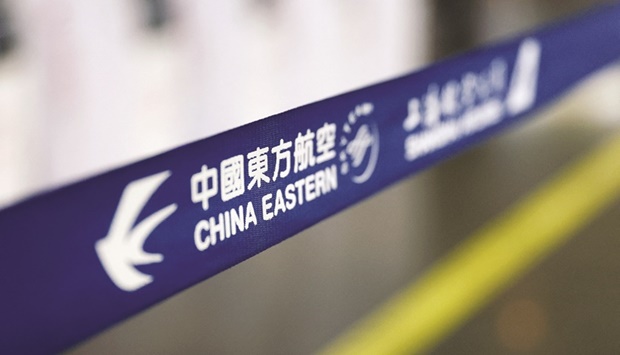 The logo of China Eastern Airlines is pictured at Beijing Capital International Airport. The state carrier forecast in January a 2021 loss of 11bn-13.5bn yuan ($1.7bn-$2.1bn), after a 11.8bn yuan loss in 2020.