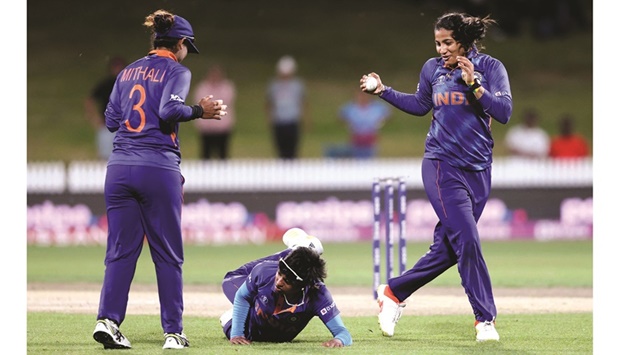 Indiau2019s Sneh Rana (right) celebrates a catch off her own bowling to dismiss  Bangladesh Nahida Akter during their 2022 Womenu2019s Cricket World Cup match at Seddon Park in Hamilton yesterday. (AFP)