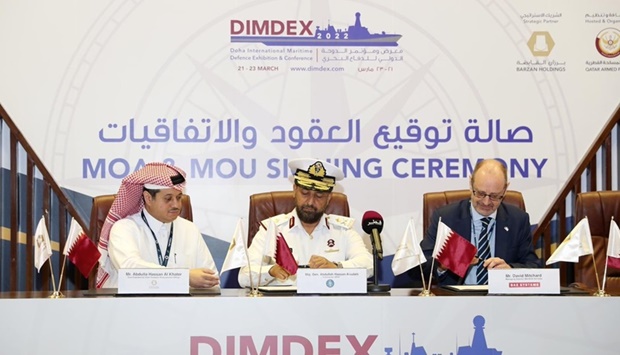 Signing of an agreement at Dimdex 2022.