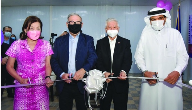 Dignitaries cutting a ribbon to mark the opening of the Lactation Room at the Philippine embassy.