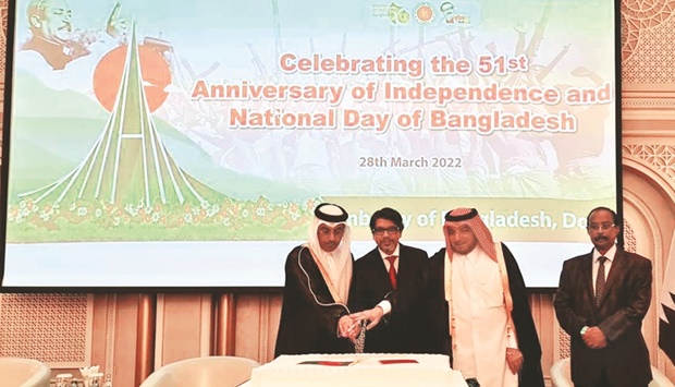 HE the Minister of Labour Dr Ali bin Saeed bin Smaikh al-Marri and Ministry of Foreign Affairs protocol director ambassador Ibrahim Fakhroo joins Bangladesh ambassador Mohamed Jashim Uddin in cutting a ceremonial cake at the reception as the Diplomatic Corps dean and Eritrean ambassador Ali Ibrahim Ahmed looks on.