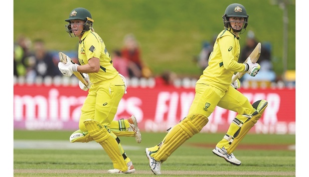 Australiau2019s Rachael Haynes (right) and Alyssa Healy runs between the wickets during the Womenu2019s Cricket World Cup semi-final against the West Indies at the Basin Reserve in Wellington yesterday. (AFP)