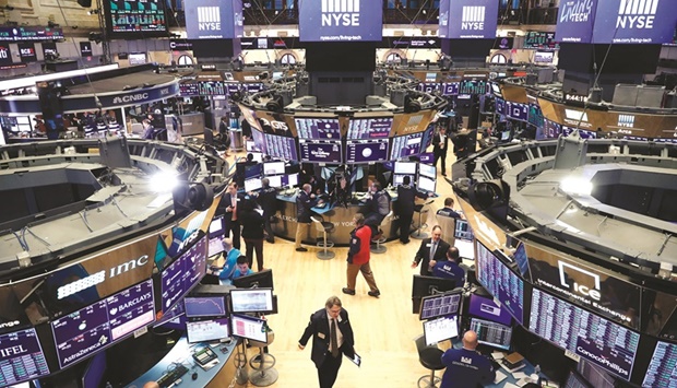 Traders work on the floor of the New York Stock Exchange (file). Geopolitical worries are clouding the outlook for US stocks, even as Russiau2019s invasion of Ukraine moderates expectations for how aggressively the Federal Reserve will tighten monetary policy in coming months.