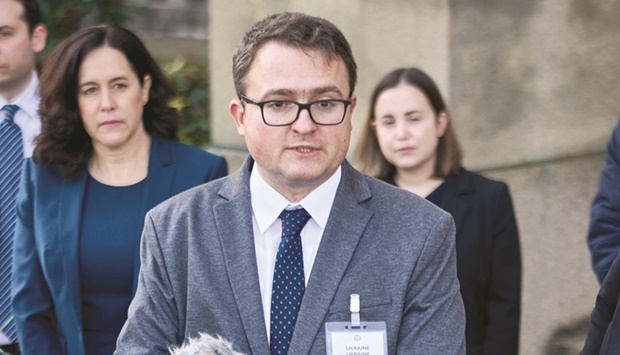 Anton Korynevych, Permanent Representative of the President of Ukraine in the Autonomous Republic of Crimea and Oksana Zolotaryova, Director, International Law Department, Ministry of Foreign Affairs of Ukraine at the International Criminal Court, talk to the media in The Hague yesterday. (Reuters)