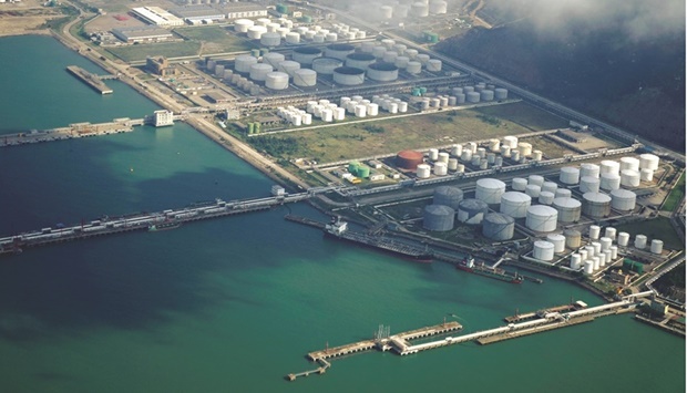 Oil and gas tanks are seen at an oil warehouse at a port in Zhuhai. China is the worldu2019s biggest oil importer, purchasing more than $257bn worth of crude last year, according to official statistics.