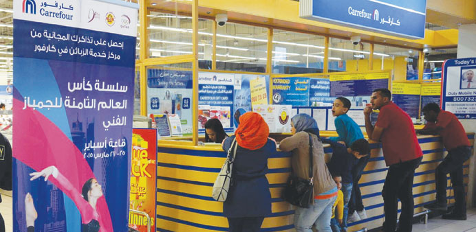 Fans line-up to buy tickets for the Artistic Gymnastics Challenge Cup at a Carrefour branch in Villaggio.