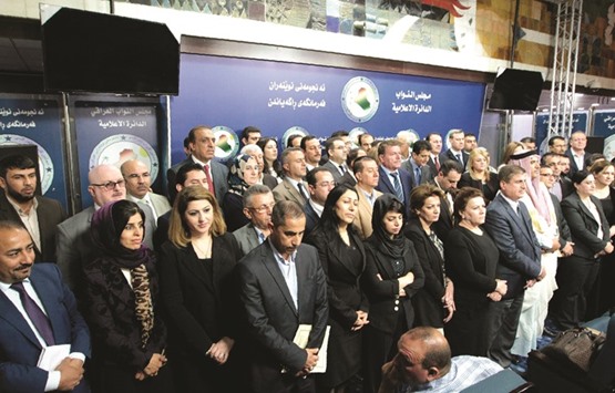Iraqi lawmakers address a press conference in Baghdad yesterday.