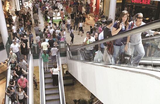 Shoppers stand on escalators inside a shopping mall in Jerusalem (file). The economy grew at an annualised rate of 3.8% in the fourth quarter for its strongest period of 2015, the Central Bureau of Statistics said yesterday.