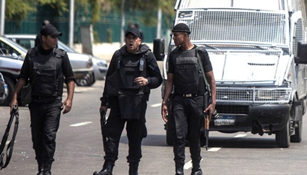 Egyptian police stand guard