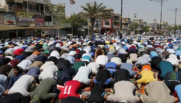 Supporters of prominent Iraqi Shia cleric Moqtada al-Sadr attend Friday prayers in Baghdad's Sadr City.