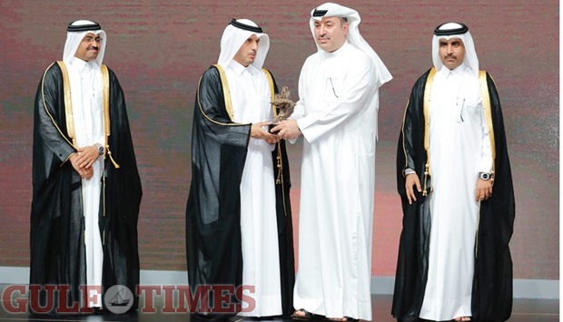 HE the Prime Minister and Interior Minister Sheikh Abdullah bin Nasser bin Khalifa al-Thani honouring Alfardan Group president and CEO Omar Alfardan as HE the Minister of Energy and Industry Dr Mohamed bin Saleh al-Sada and Kahramaa president Essa bin Hilal al-Kuwari look on.