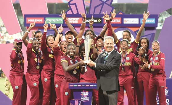 ICC Chief Zaheer Abbas presents the winnersu2019 trophy to West Indiesu2019s Stafanie Taylor after West Indies won the World T20 cricket tournament womenu2019s final yesterday.