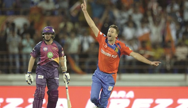 Gujarat Lions bowler Andrew Tye (right) celebrates the wicket of Rising Pune Supergiant batsman Shardul Thakur to complete a hat-trick yesterday. (AFP)