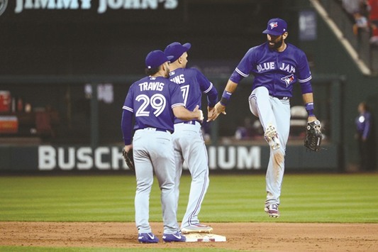 St. Louis Cardinals (L ro R) Aledmys Diaz, Carlos Martines and