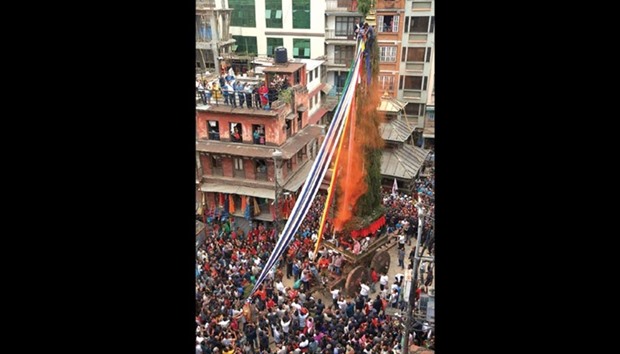 Devotees offer prayer as chariot of Seto Machhendranath is pulled during the second day of the Chariot Festival in Kathmandu yesterday. The Chariot Festival is held for good rain to prevent drought during the rice harvest season.