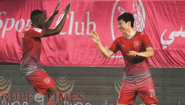Nam Tae-hee (R) celebrates his winning goal with Mohamed Musa on Thursday. Picture: Noushad Thekkayil