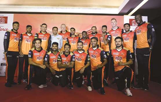 Sunrisers Hyderabad team mentor VVS Laxman (top 3L), Sunrisers chief executive officer K. Shanmugam (top 4L), coach Tom Moody (C), vice-captain Bhuvneshwar Kumar (top 6L), and bowling coach Muttiah Muralitharan (top 7L), pose with their new signings before the start of the 2018 Indian Premier League yesterday. (AFP)