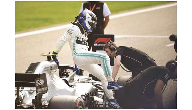 Mercedesu2019 Finnish driver Valtteri Bottas gets out of his car after taking pole position in Shanghai yesterday.