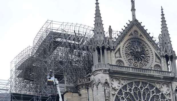 Firefighters work at Notre-Dame Cathedral in Paris.