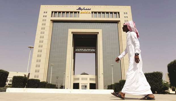 A man walks past the headquarters of Saudi Basic Industries Corp (Sabic) in Riyadh (file). The worldu2019s fourth-biggest petrochemicals firm has posted a 38% drop in first-quarter earnings, missing analyst expectations.